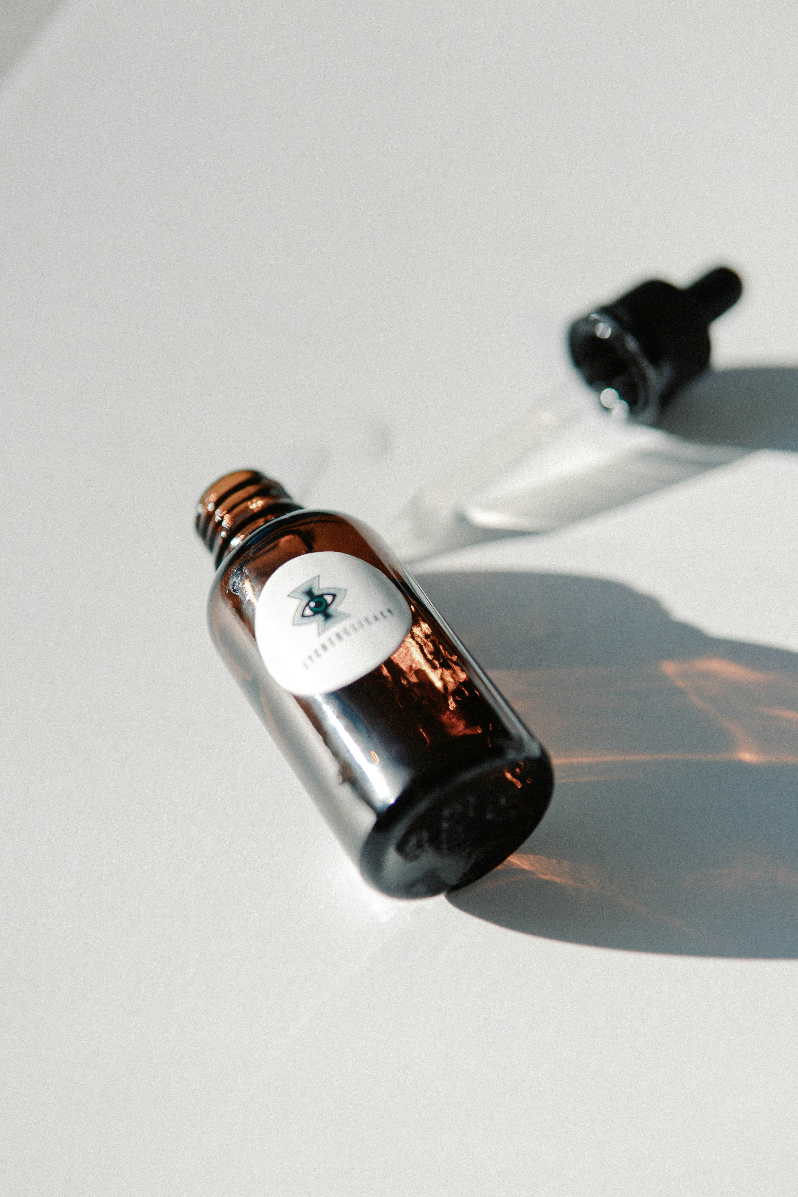 black glass bottle on white table